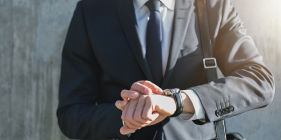 Man checking his watch - LEAD Program leadership training course