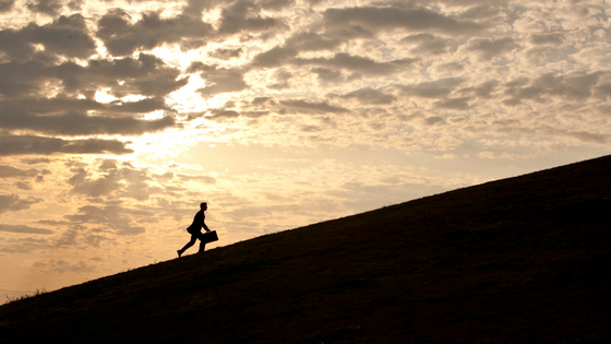 Man walking uphill - LEAD Program leadership training course